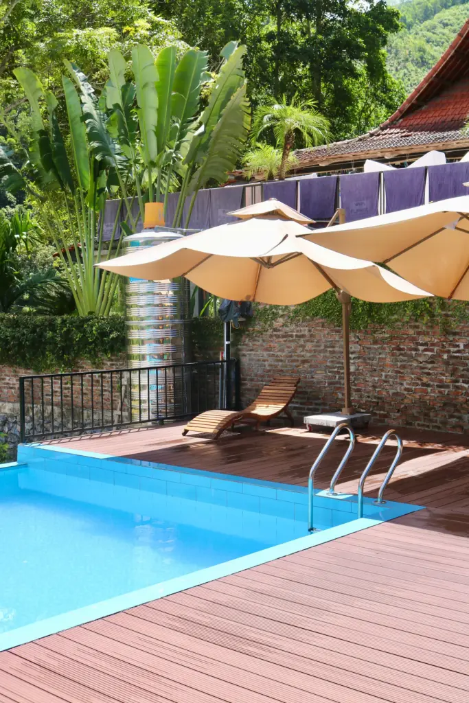 Poolside sun loungers at Infinity Hostel Ha Giang